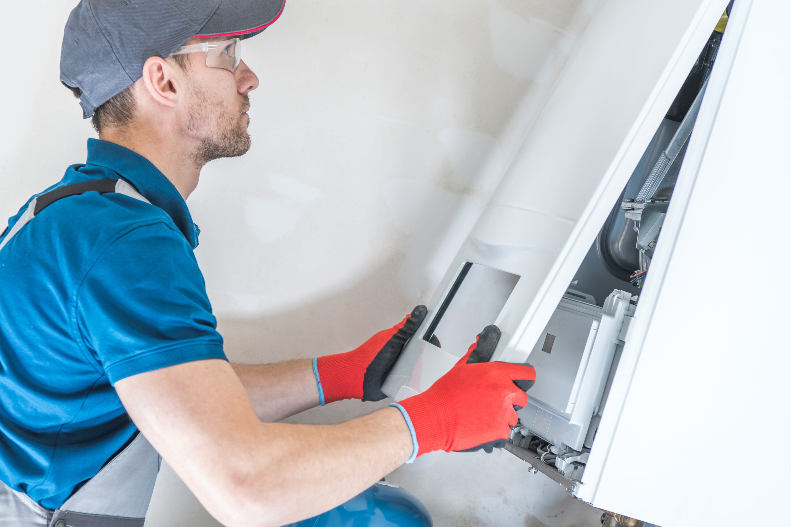 House,Heating,Unit,Repair,By,Professional,Technician.,Closeup,Photo.,Home
